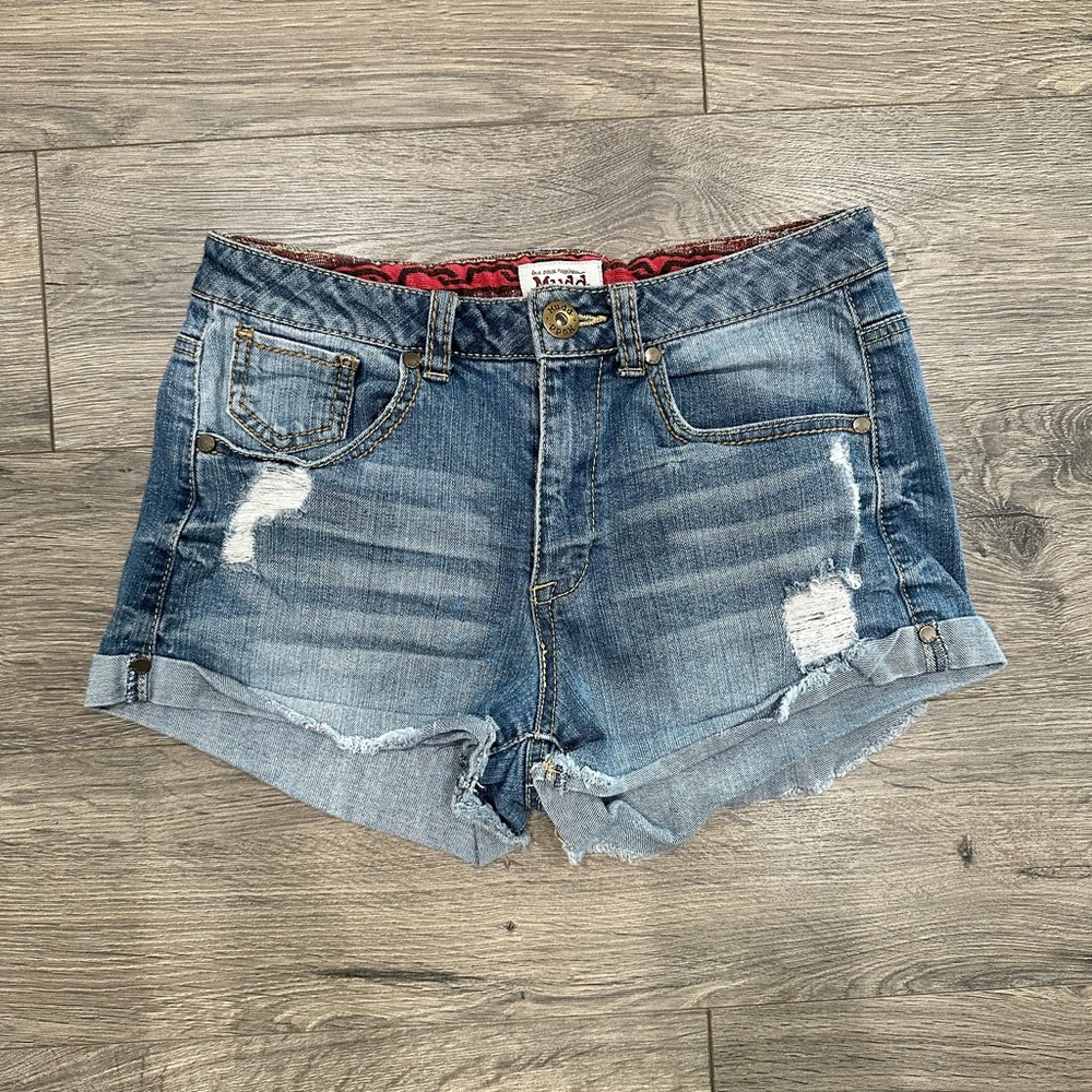 Distressed blue jean shorts